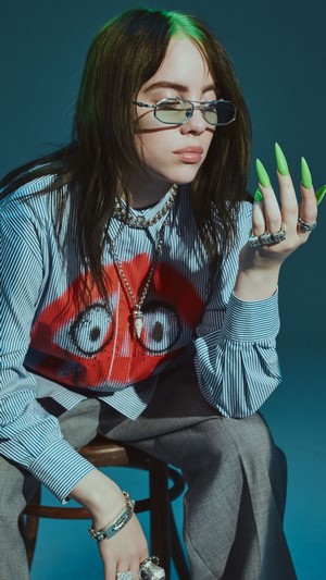 Billie Eilish wearing glasses and jewelry