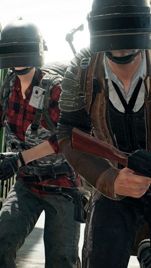 Two players in PUBG wearing helmets and tactical gear