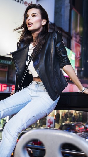 Emily Ratajkowski in a black jacket and jeans