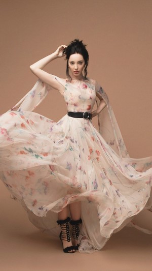 Emma Dumont in a floral dress