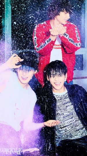 TXT members in rain with purple glitter
