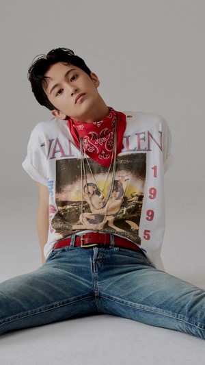 Mark from SuperM wearing a bandana and graphic t-shirt