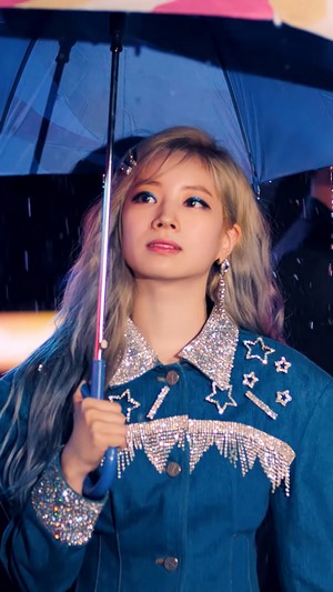 Dahyun from TWICE holding an umbrella