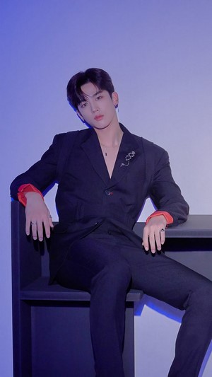 Yohan in a black suit