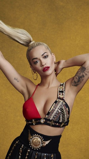 Rita Ora in a red and black outfit