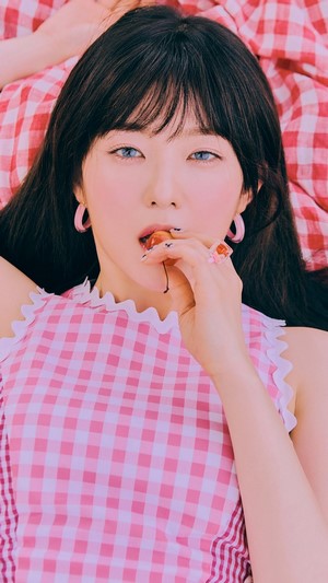 Irene from Red Velvet eating a cherry