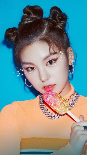 Yeji from ITZY holding a popsicle