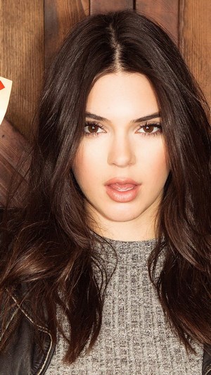 Kendall Jenner posing with cards