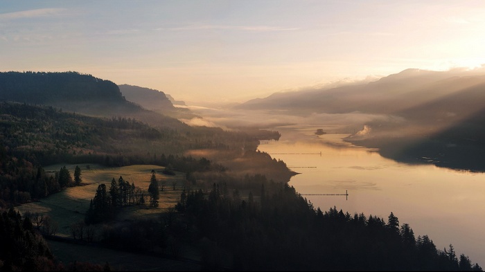Misty River Valley at Sunrise with Sunbeams