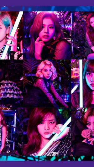 TWICE members in colorful lighting