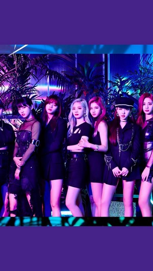 TWICE members posing in dark outfits