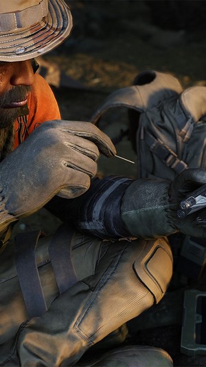Ghost Recon Breakpoint soldier tending to wound