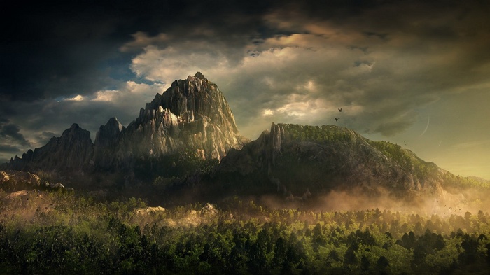 Jagged mountain range with forest and stormy clouds