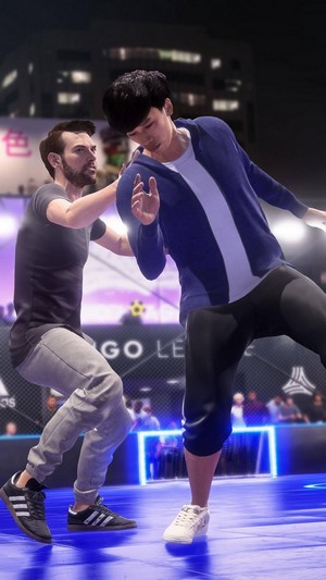 Two men playing FIFA 20