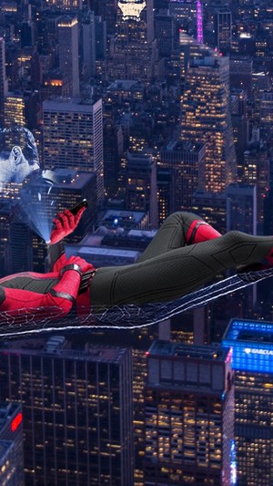 Spider-Man from Marvel's Far From Home using a phone