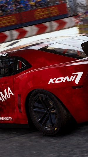 Red racing car with KONI and YAMAHA logos on track