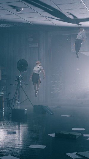 Jesse Faden and a levitating man in Control
