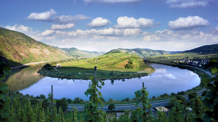 River bend with vineyards and a village