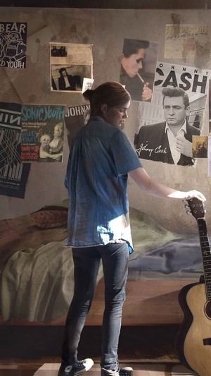 Ellie from The Last of Us Part 2 with a guitar
