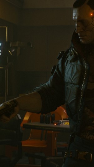 Man with cybernetic arm in Cyberpunk 2077