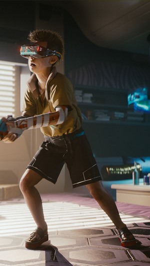 Boy with VR headset playing Cyberpunk 2077