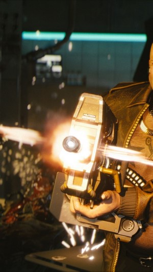 Man firing a weapon in Cyberpunk 2077