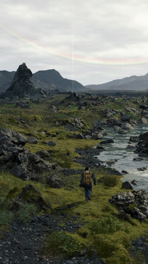 Man with backpack in Death Stranding landscape