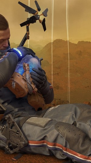 Sam from Death Stranding holding BB