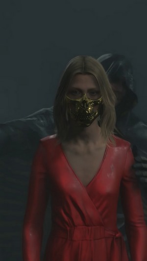 Amelie from Death Stranding wearing a golden skull mask