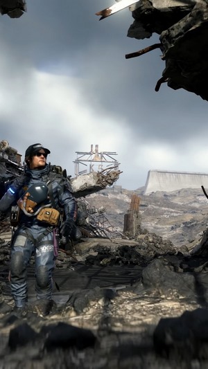 Sam Porter Bridges from Death Stranding in a ruined landscape