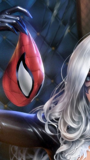 Black Cat holding Spider-Man mask