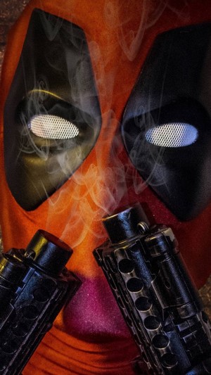 Deadpool with guns and smoke