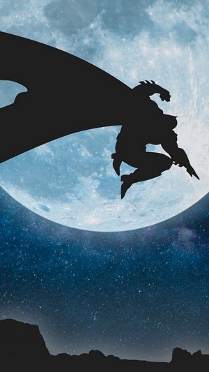 Batman silhouette against a large moon