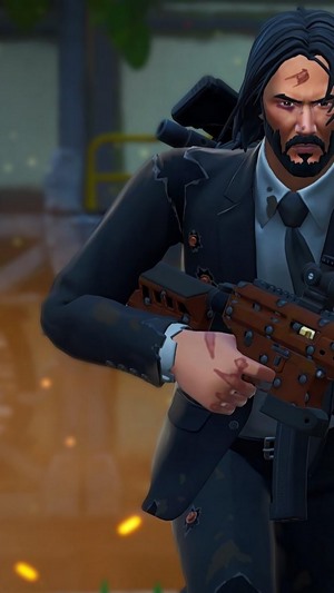 John Wick from Fortnite holding a rifle