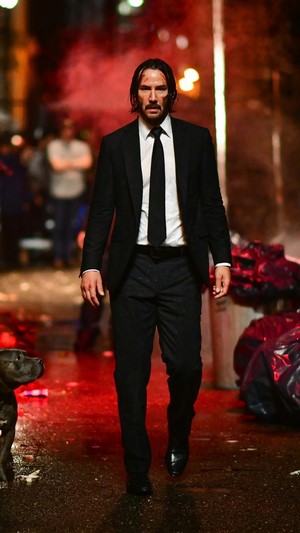 John Wick from John Wick 3 with a dog