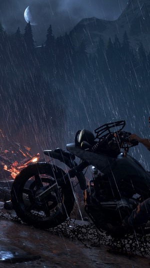 Deacon St. John from Days Gone on a motorcycle in the rain