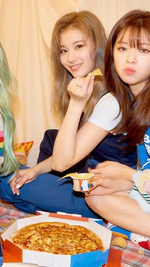Sana and Jeongyeon from TWICE's Fancy You era