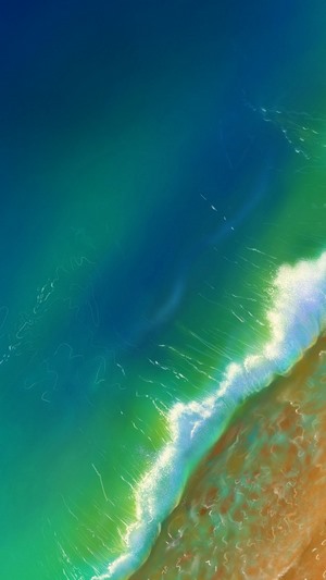 Ocean waves crashing on a sandy beach