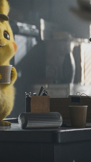 Detective Pikachu holding a cup
