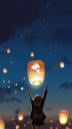 Girl releasing sky lanterns at night