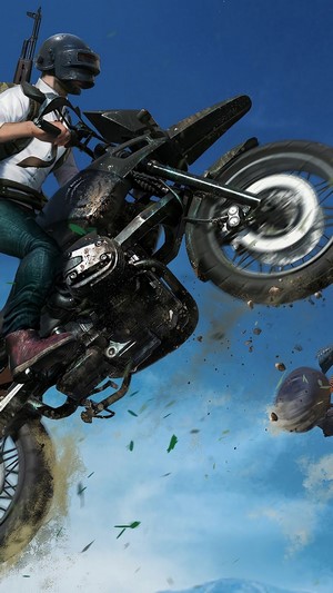 Player jumping on a motorcycle in PlayerUnknown's Battlegrounds