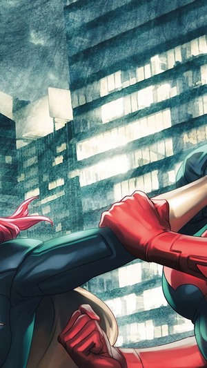 Batgirl and Batwoman fighting in a city