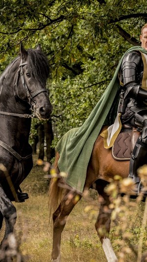 Hellboy on horseback in a forest