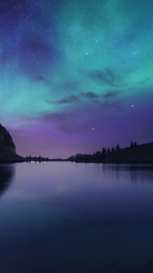 Aurora Borealis over a lake at night