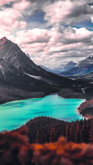 Turquoise Lake Surrounded by Mountains and Forests