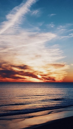 Seascape with Sunset over the Ocean and Beach