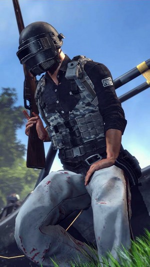 Player from PUBG holding a rifle
