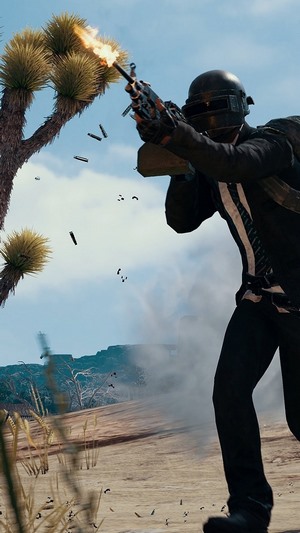 Player from PUBG shooting a gun