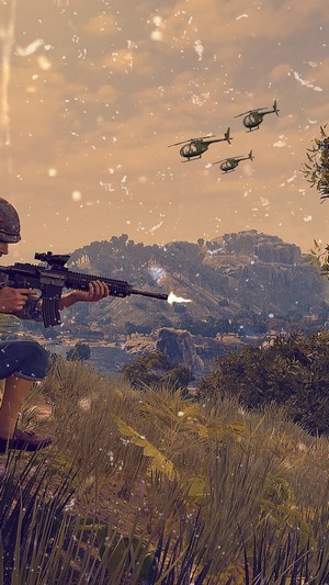 Player shooting rifle with helicopters in PlayerUnknown's Battlegrounds