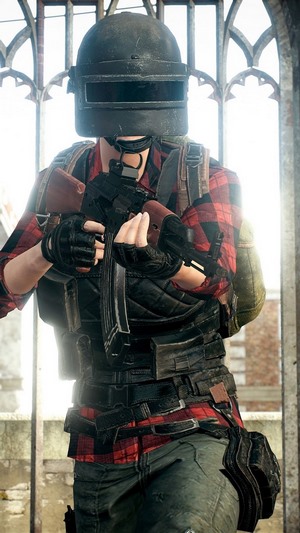 PlayerUnknown's Battlegrounds character with helmet and rifle